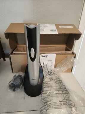 New In Box. Oster Silver and Black Electric Wine Opener with Charging Base.